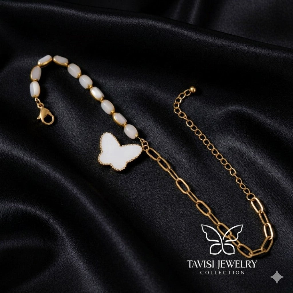 Gold White Butterfly Charm Bracelet with bead chain on white fabric - Tavisi Jewelry Collection