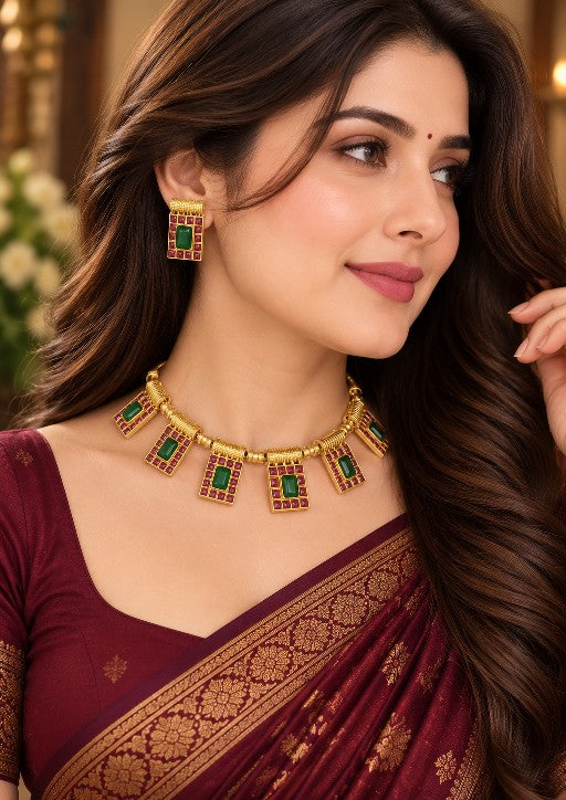 Indian woman wearing Ishani green and ruby traditional necklace set with matching earrings