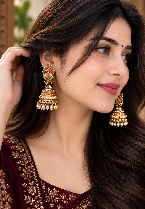 Woman wearing Ishani premium brass traditional jhumka earrings with pearl drops