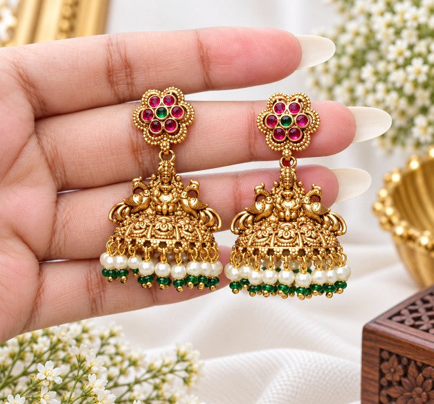 Kavisha premium brass Lakshmi jhumka earrings with red green stones and pearl drops