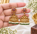 Kavisha premium brass Lakshmi jhumka earrings with red green stones and pearl drops