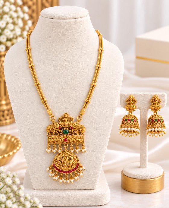 Kavya antique gold Lakshmi pendant necklace set with matching Jhumka earrings