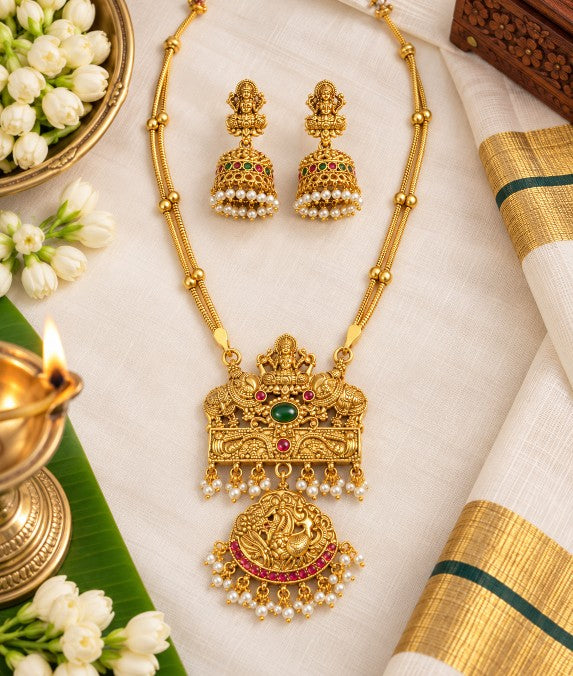 Kavya Lakshmi pendant necklace with pearl drops and red green decorative stones
