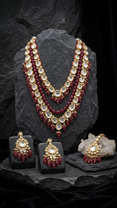 Premium brass maroon Kundan bridal necklace set front view.