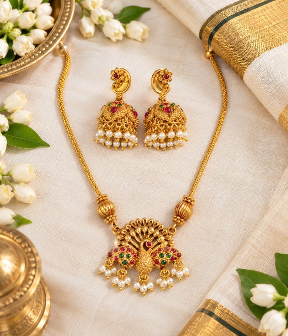 Antique Gold premium brass peacock pendant necklace with pearl embellishments and jhumka earrings
