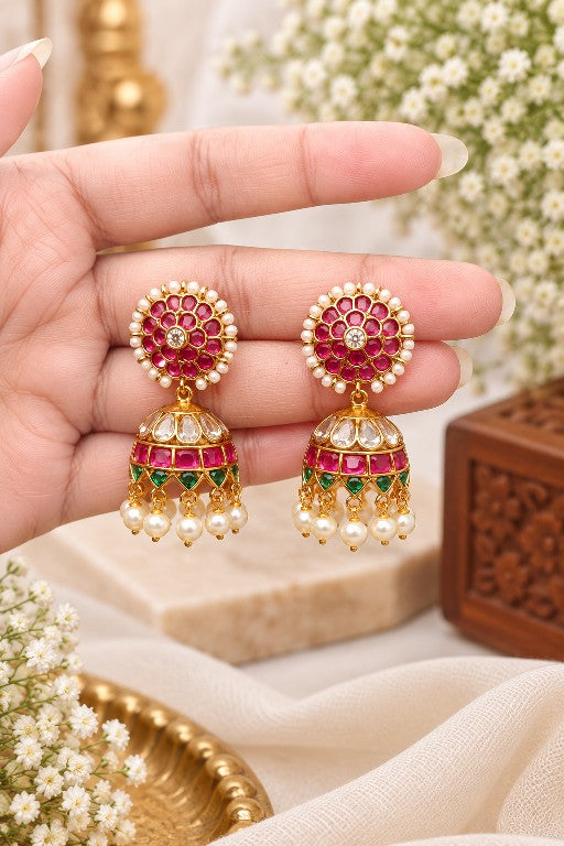 Meharika premium brass floral pearl jhumka earrings with pink green stones and gold finish