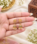 Nandini mini AD stone pearl jhumka earrings with green and red stones