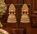 Navika Peacock Pearl Jhumka Earrings gold plated brass traditional earrings