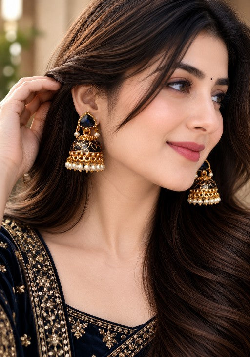 Woman wearing Nayara premium brass blue and black jhumka earrings with pearl drops