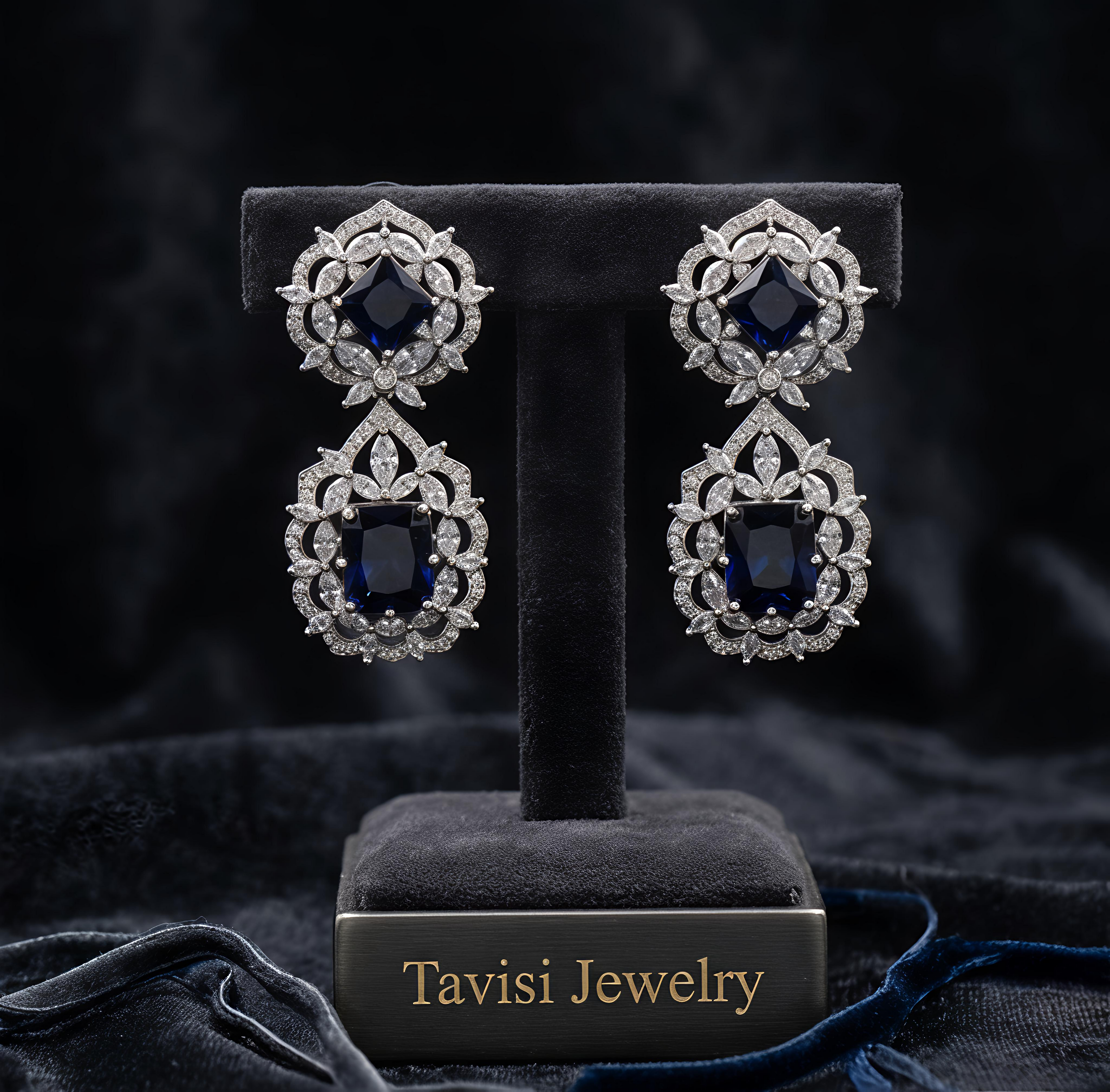 Tavisi Nayra Blue Royale AD Statement Earrings featuring sparkling American Diamond stones and luxurious navy blue centre stones.