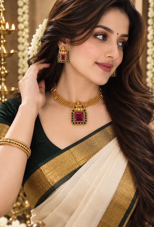 Woman wearing Padmalaya Antique Gold Matte pendant necklace with matching earrings