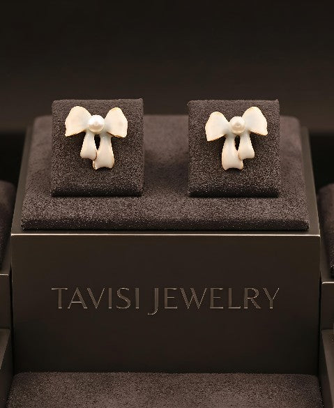 Tavisi pearl bow stud earrings in 22k gold plated surgical stainless steel for women