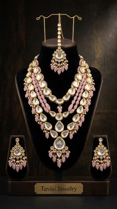 Premium brass pink Kundan bridal necklace set front view.