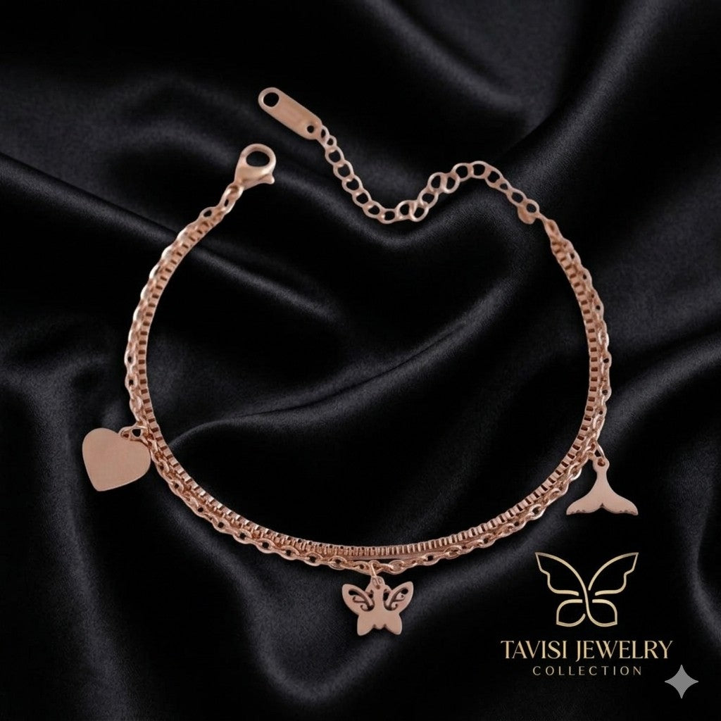 Rose Gold Butterfly Heart Charm Bracelet with heart and wing charms close up - Tavisi Jewelry Collection