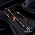 Rose Gold Crescent Moon Chain Bracelet on white fabric - Tavisi Jewelry Collection