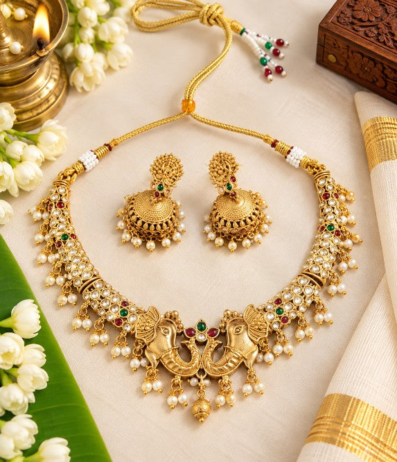 Shriya Antique Gold Matte Kundan Pearl Necklace Set with elephant motif and Jhumka earrings