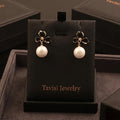Tavisi black flower pearl drop earrings with 22K gold plating and anti tarnish finish for women