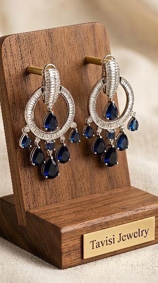Tavisi blue sapphire CZ chandelier earrings in silver tone front view with luxury detailing