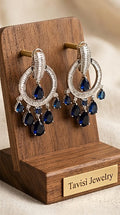 Tavisi blue sapphire CZ chandelier earrings in silver tone front view with luxury detailing