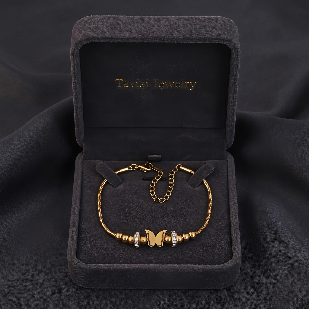 Tavisi Butterfly Charm Anti Tarnish Bracelet with gold butterfly centerpiece, zircon stone accents, 22K gold plated 316L surgical stainless steel and long lasting shine.