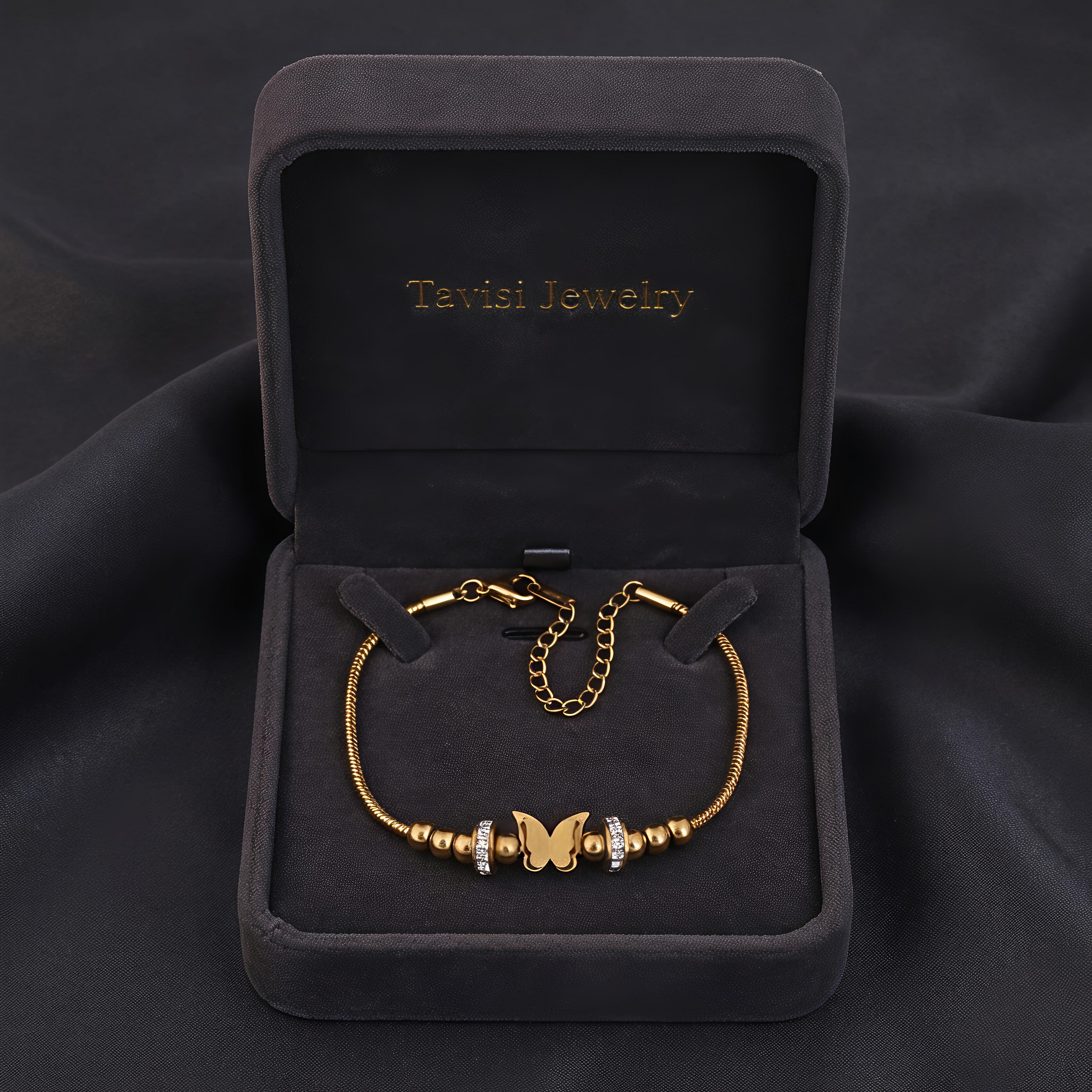 Tavisi Butterfly Charm Anti Tarnish Bracelet with gold butterfly centerpiece, zircon stone accents, 22K gold plated 316L surgical stainless steel and long lasting shine.