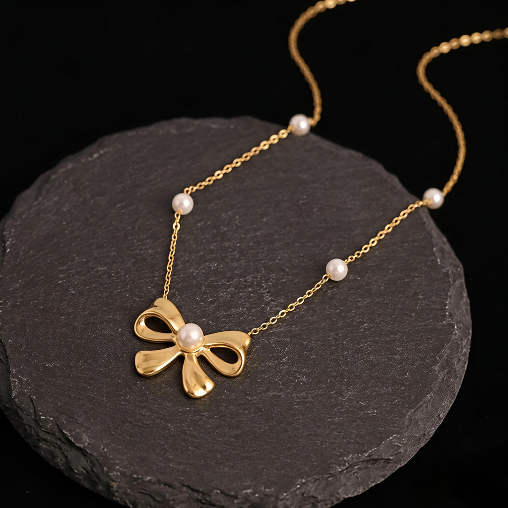 Close-up of Tavisi Celina Bow Pearl Necklace featuring anti tarnish waterproof stainless steel with elegant pearl bow design