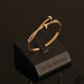 Tavisi Celina Curve rose gold plated AD stone anti tarnish stainless steel bracelet