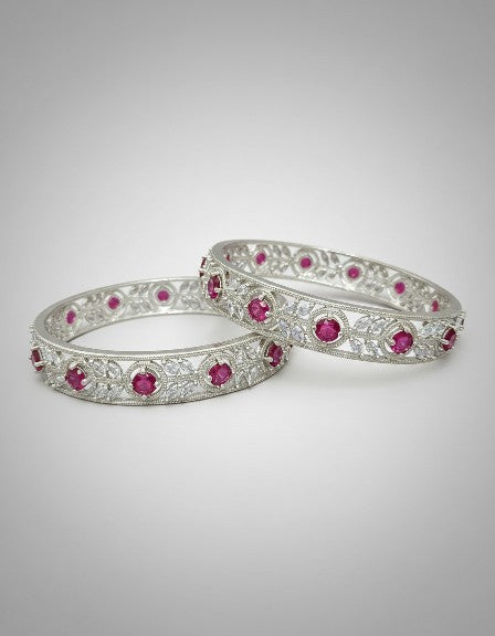 Angle view of Tavisi Crimson Elegance ruby CZ silver polish bangle with long lasting finish