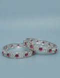 Front view of Tavisi Crimson Elegance ruby CZ silver polish bangle size 2.6 for women 