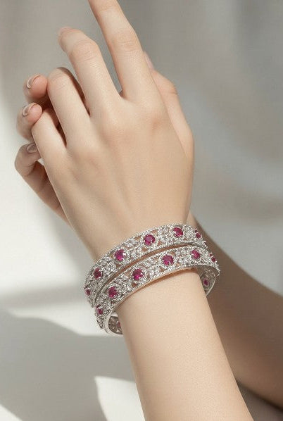 Tavisi Crimson Elegance Ruby CZ Silver Polish Bangle for Women in Size 2.6 featuring sparkling white CZ stones, ruby CZ stones, premium silver polish finish, and anti-tarnish handcrafted design.