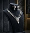 Tavisi Crystal Royale AD CZ Premium Brass Silver Finish Statement Bridal Necklace Set with Matching Earrings