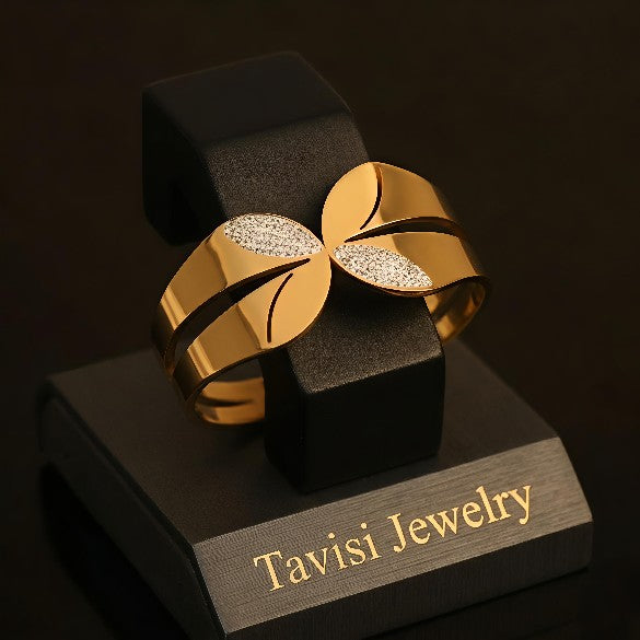 Tavisi CZ Leaf Open Cuff Gold Bracelet in 316L surgical stainless steel with 22K gold plated anti tarnish finish, sparkling CZ leaf detailing, adjustable waterproof designer bracelet for women
