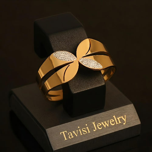 Tavisi CZ Leaf Open Cuff Gold Bracelet in 316L surgical stainless steel with 22K gold plated anti tarnish finish, sparkling CZ leaf detailing, adjustable waterproof designer bracelet for women
