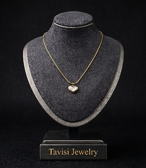 Tavisi Elara Heart Pendant Necklace featuring a gold plated heart design with elegant white detailing
