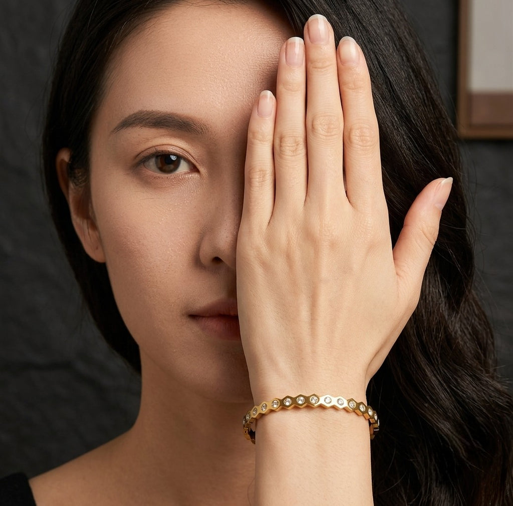 Woman wearing Tavisi Elara Spark gold plated AD stone anti tarnish bracelet.