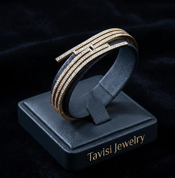 Tavisi elegance wave bracelet in 22K gold plated 316L surgical stainless steel with CZ stones, anti tarnish finish, open lock design, size 2.4
