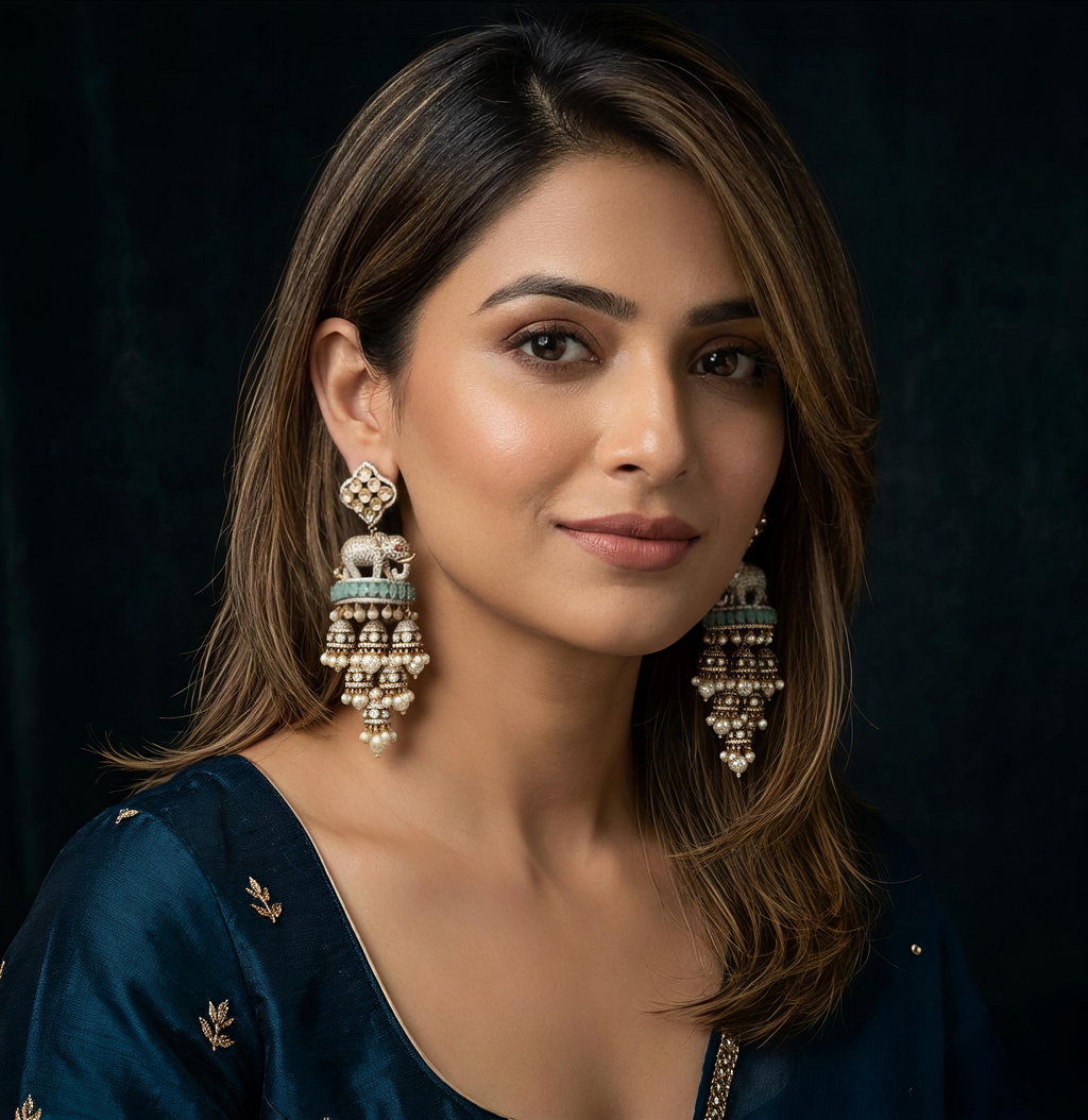 Detailed view of Tavisi Elephant Motif Polki Kundan AD Long Jhumki Earrings showcasing intricate craftsmanship, Mint Green stones and elegant pearl accents.