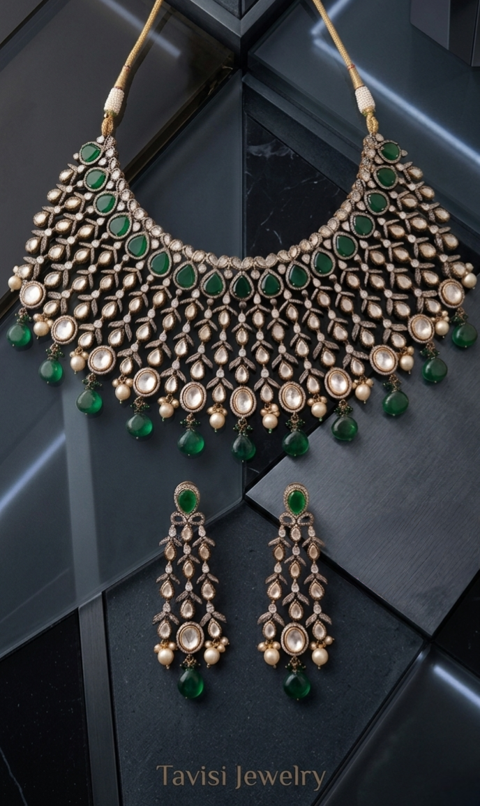 Close up of Tavisi handcrafted mehndi finish brass casting AD CZ bridal choker with green stones and pearl detailing