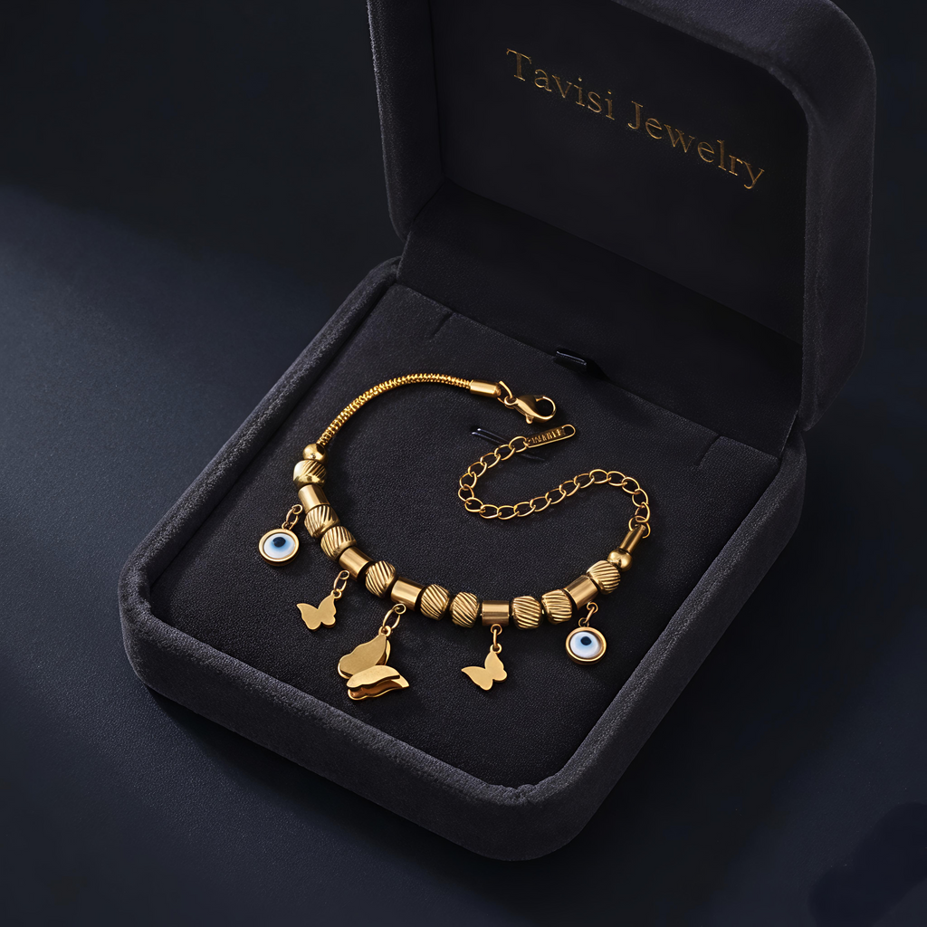 Tavisi Evil Eye Butterfly Charm Bracelet crafted in 316L surgical stainless steel with 22K gold plating, featuring butterfly charms, evil eye accents, waterproof anti tarnish finish and long lasting shine.