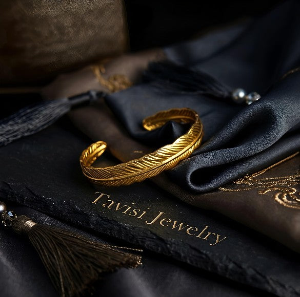 Front view of Tavisi Feather Glow gold plated anti tarnish bracelet crafted in premium 316L stainless steel for women