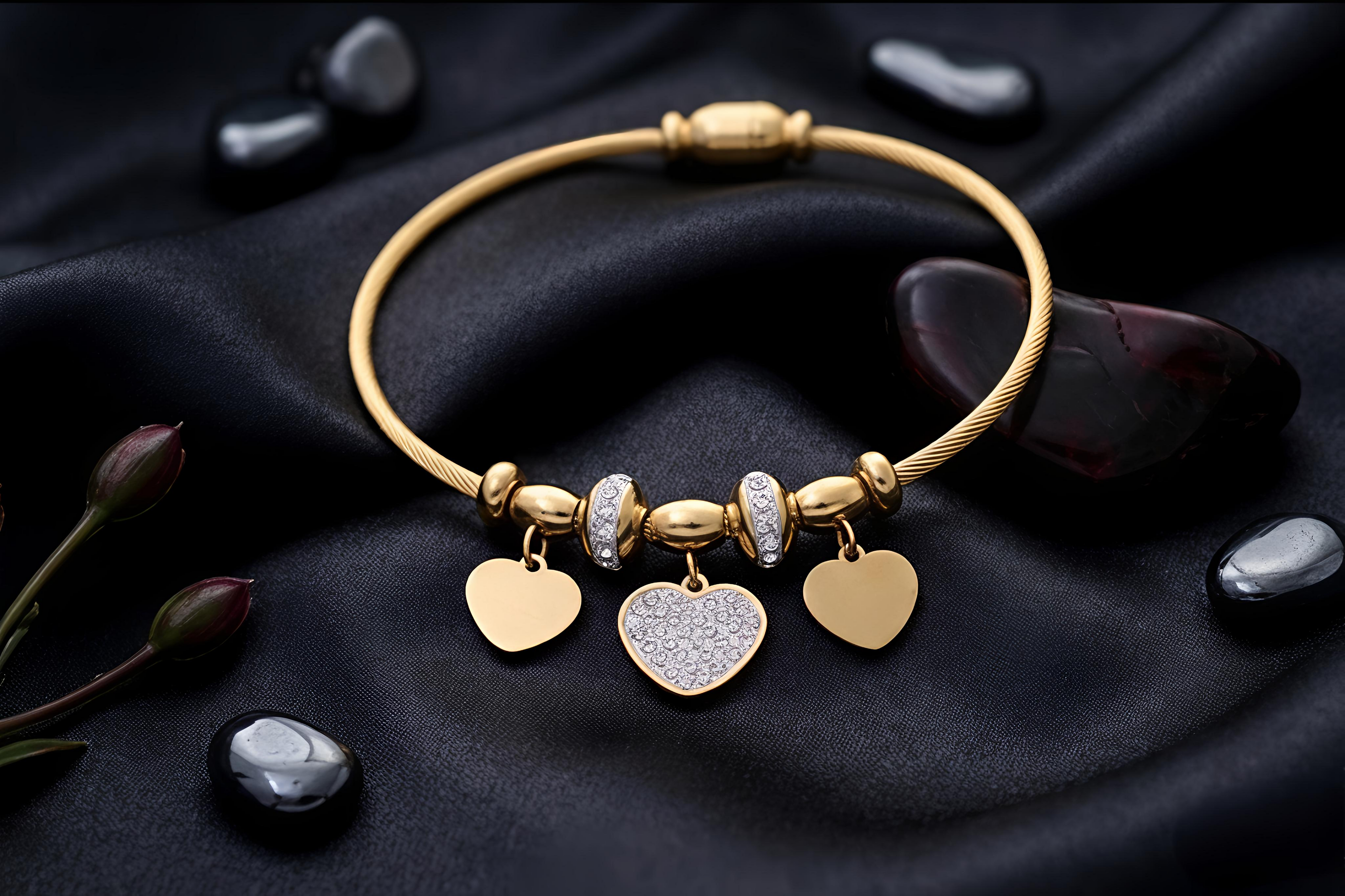 Close-up view of Tavisi Heart Charm Bracelet featuring sparkling AD stones, elegant heart charms and premium gold plated stainless steel construction.