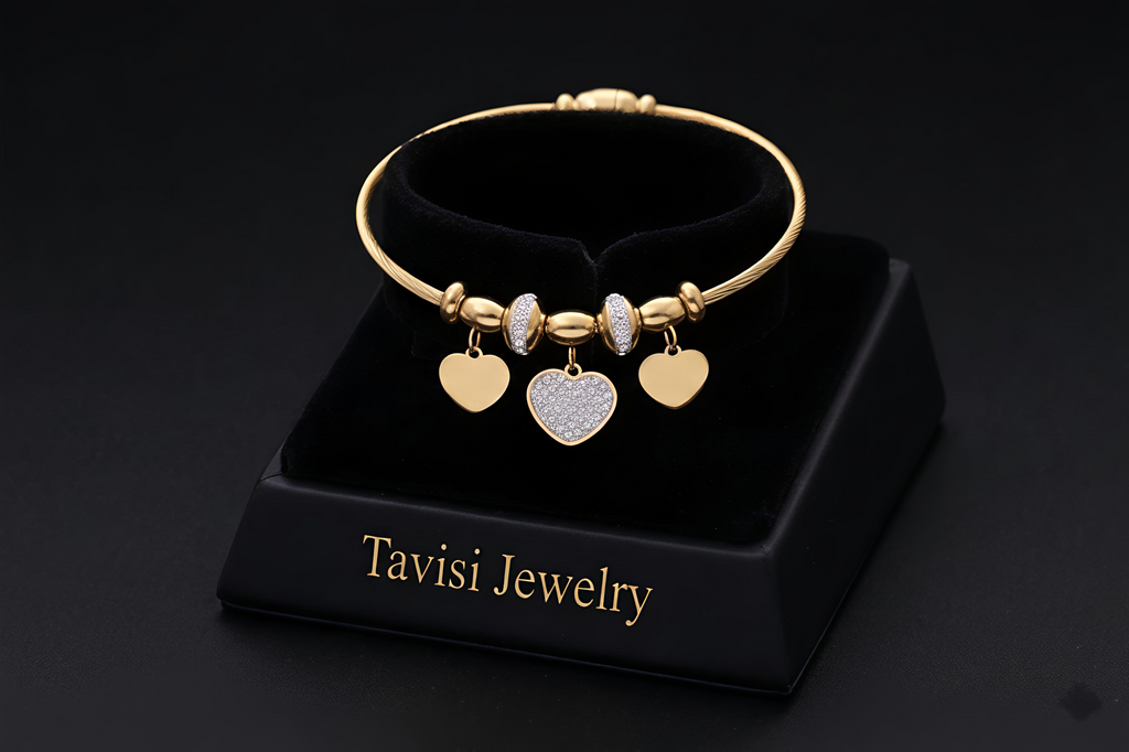 Tavisi Heart Charm Bracelet crafted in 316L surgical stainless steel with AD stones, 22K gold plating, waterproof anti tarnish finish and long lasting shine.