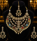 Tavisi imperial AD kundan bridal necklace set with multicolor stones, pearls, matching earrings and maang tikka front display.