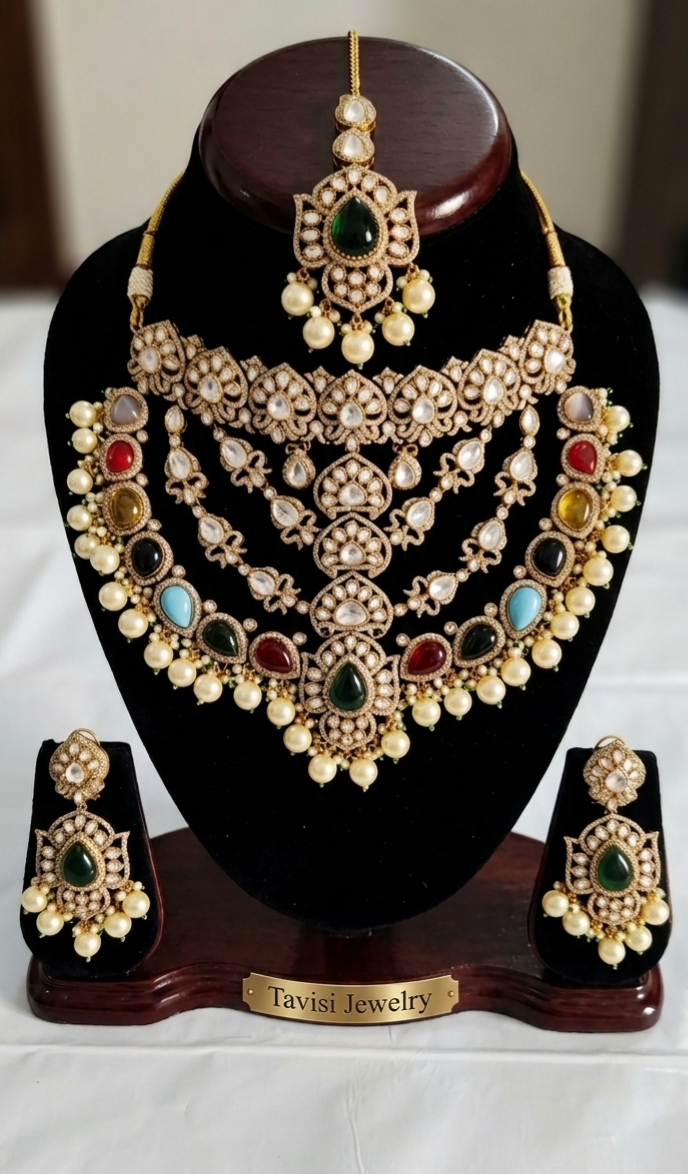 Tavisi imperial AD kundan bridal necklace set with multicolor stones, pearls, matching earrings and maang tikka front display.