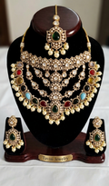 Tavisi imperial AD kundan bridal necklace set with multicolor stones, pearls, matching earrings and maang tikka front display.