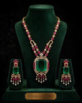 Tavisi long lasting brass casting necklace set with AD CZ Jardin Emerald green white and Rani Pink stones main product image.