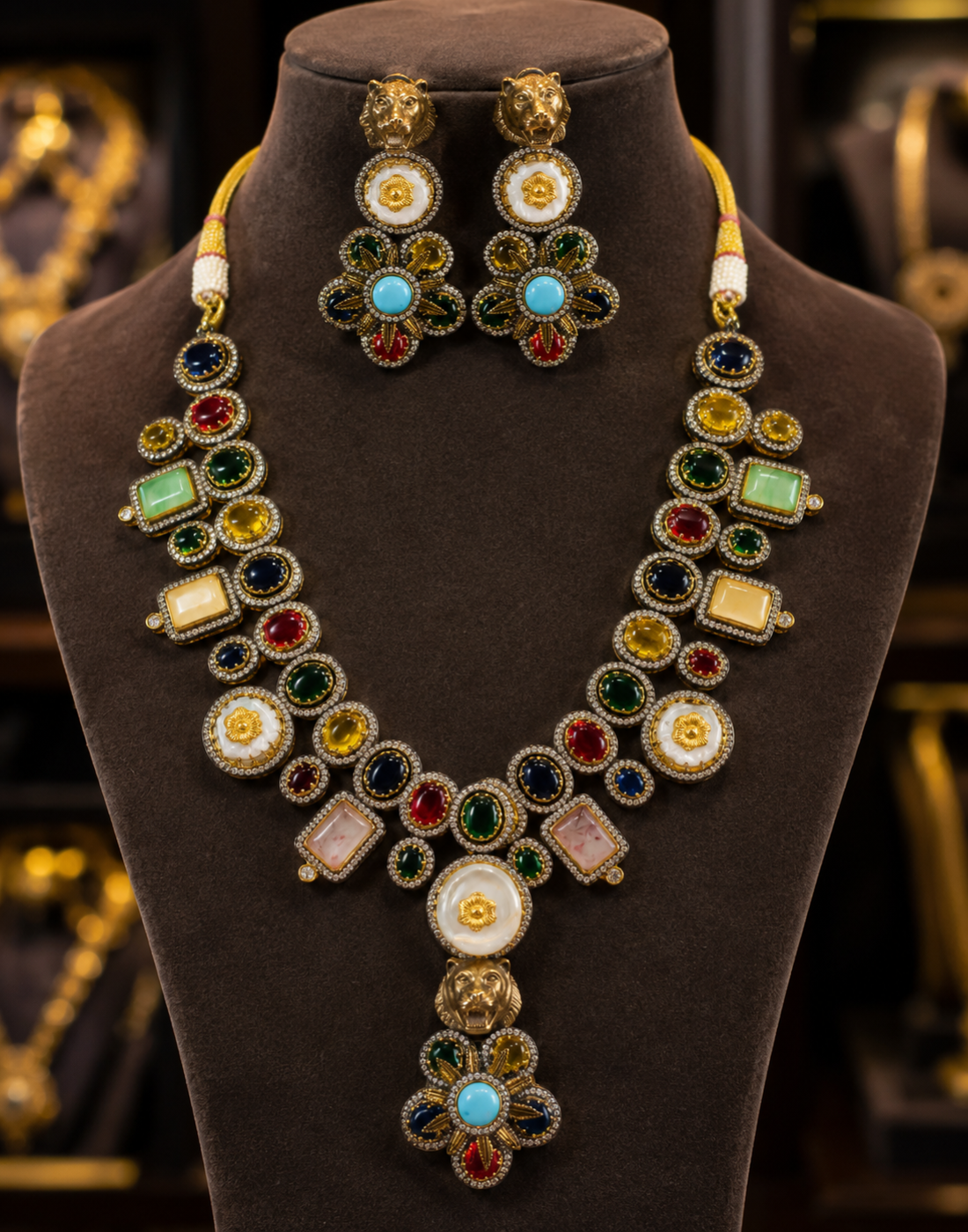 Tavisi lion motif necklace set with white moissanite stones, multicolor kundan detailing and pearl accents front view.