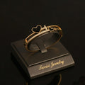 Tavisi love initial kada in 22K gold plated 316L surgical stainless steel with heart motif, CZ stones, open lock design, size 2.4
