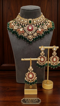 Heavy Tavisi CZ kundan bridal choker set with green stones ruby detailing green beads matching earrings and maang tikka front display