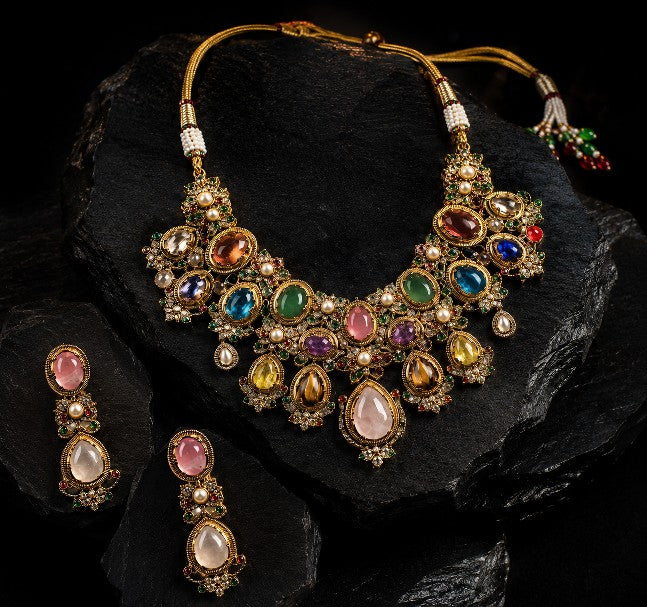Close-up of Tavisi Navaratna Royale necklace with moissanite polki, kundan detailing, pearls and multicolor stones.